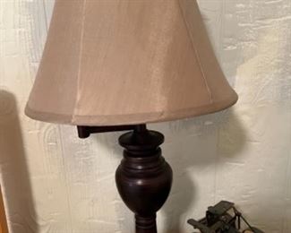 Two matching brown swing lamps