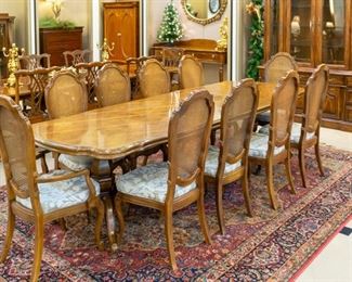 Table, 10 chairs, and 2 leaves.