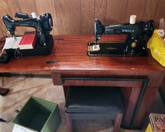 Antique Singer sewing machines with cabinet.