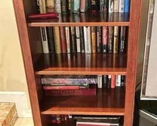 Pair of bookshelves with books.