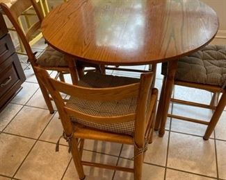 Round table with four chairs.