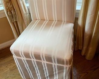 Pair of taupe and white striped side chairs.