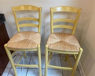 Pair of painted cane chairs.