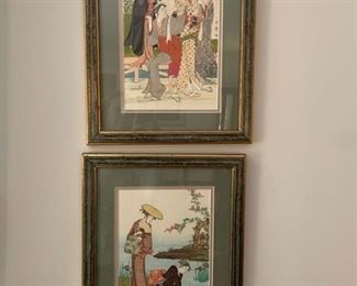 Pair of framed art prints.