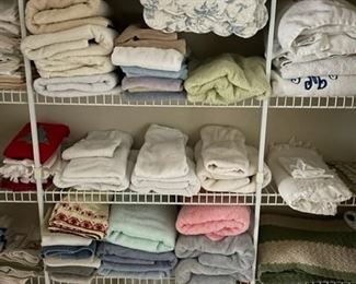 Assorted towels, sheets and blankets.