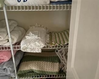 Assorted towels, sheets and blankets.