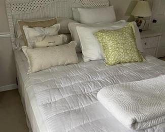 White wicker bedroom suite - bed, vanity table/chair, settee, bench, mirror, small cabinet.