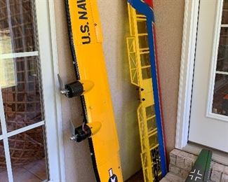 Parts to planes hanging in the garage