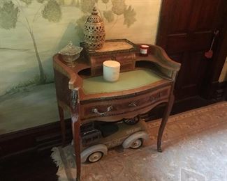 French desk with the top that pulls out to extend the writing surface. The inlaid wood work is gorgeous!