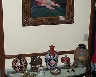 Glass top sofa table, oil painting, three pottery vases by Enmanuel Maldonado