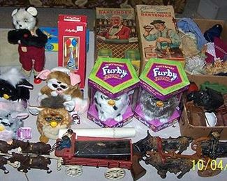 More toys including Furbys, cast iron toys, Bartender wind up toys w/ original boxes, etc...