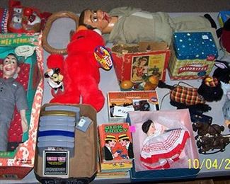 Sample of toys including PeeWee Herman doll, Nintendo 64 games, Tickle Me Elmo, etc...