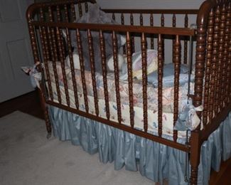 Baby bed with skirt, bumper pads, and blanket