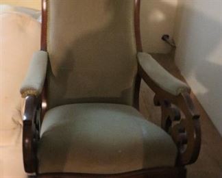Antique upholstered rocking chair