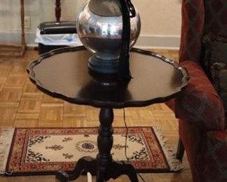 Piecrust table with chrome sphere lamp