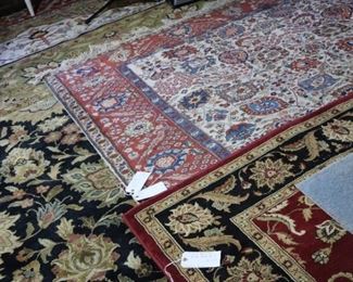 Stacks of oriental rugs, garage