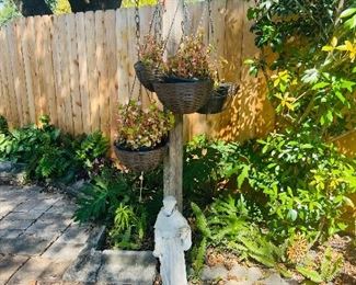 Hanging wire baskets w/plants 
Religious cement statue