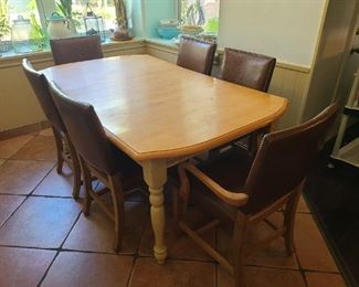 Large table w/leaf
6 leather w/stud border chairs