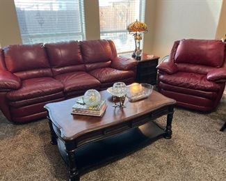 Red leather sofas and matching recliner