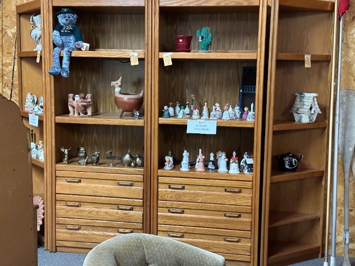 Very nice 4 piece book shelf unit and bells/pottery. Brass figurines