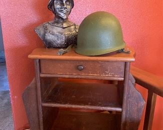 Military helmet and bust, vintage magazine table