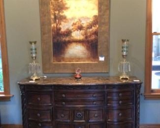 Very ornate marble top sideboard; pair of antique lusters with prisms; fabulous framed art