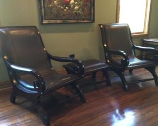 Pair of leather chairs with matching ottoman