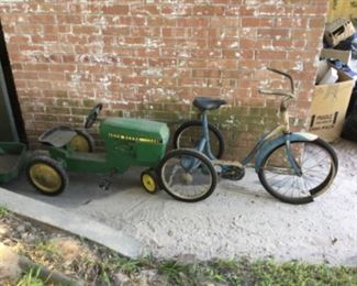 Vintage tricycle and John Deere tractor with trailer