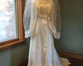 "Sophia" is wearing a beautifully detailed vintage wedding gown and matching veil!