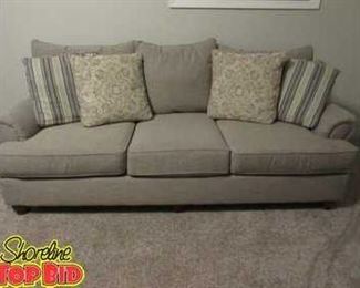 Sofa with decorative throw pillows purchased from Talsmas, Mahongany feet great condition