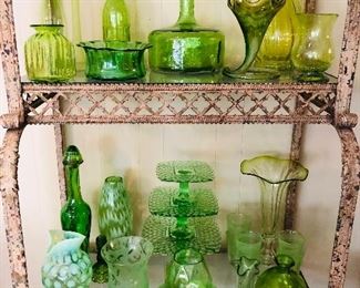 Rustic baker's rack filled with green glass