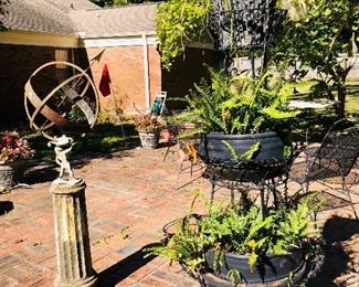 Ferns in plant stands, garden sculpture 