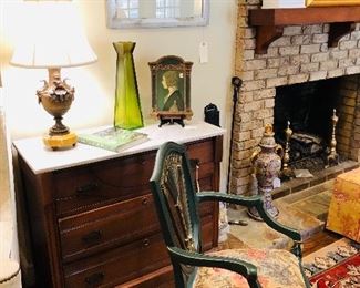 Marble top chest by upholstered side chair