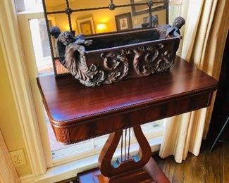 Angel basin and mirror sit on a side table