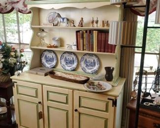 Cream and green step back cupboard