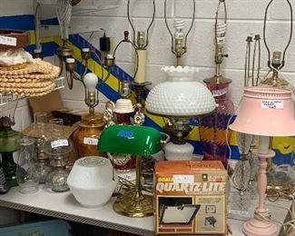 MCM electric lamps, oil lamps, light fixture globes, vintage doll baby crib, placemats, brass and glass chandelier 