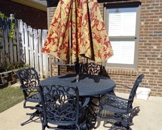 Patio set with 4 swivel chairs, table and umbrella        $450