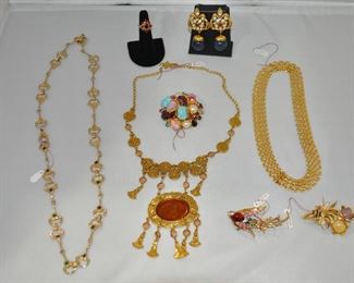Rare Vintage Brooches by Weiss, Oscar de la Renta, and a Trifari Peacock Brooch. Beautiful Gold-Tone Necklaces and in the center is Vintage Necklace with Intaglio Glass.