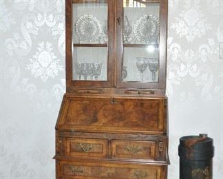 Also, in the Foyer is a Petite English Single Dome Burl Walnut Secretary. Shown with an Antique Leather Wrapped English Shell Carrier/Umbrella Stand