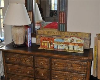 Vintage 9-Drawer Dresser with Leather Top and Carved Sailing Ship Detail on Drawers, W56" x H30" x D18".