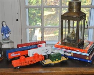 A Vintage 15" British Brass Cargo Oil Lamp, c.1939, shown with additional Lionel Train Cars and Books