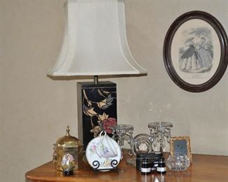 A Chapman Vintage Hand Painted Wood 27" Lamp, shown with a Vintage Le Follet Boulevart St. Martin Framed Engraving. Also, Shown is a Vintage Cambridge Cut Glass 2-Arm Candle Holder with Removable Bobeches