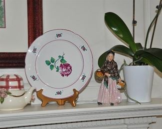 On the Mantle is a 10.5" Tiffany & Co. Plate, "Strassbourg Flowers" and a Royal Doulton, "The Orange Lady" Figurine