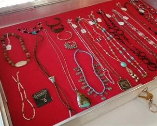 Lots of necklaces, some by Lia Sophia.