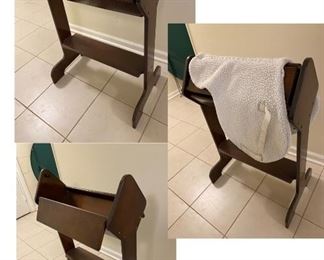 Saddle rack with top that folds out to flip saddle for cleaning 