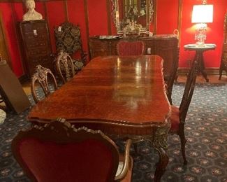Elegant Louis XV Revival Style carved Mahogany, Burl and Fruitwood Marquetry dining Table with Six Chairs.