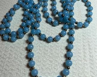 Long single strand glass beads