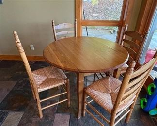 Round kitchen table with 4 ladder back chairs