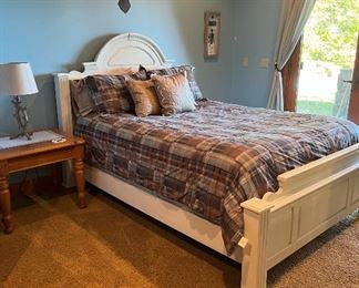 Full Size bed with cream wood headboard and footboard