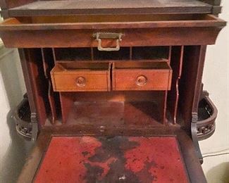 Very rare antique secretary type desk with two very ornate side shelves and numerous drawers
